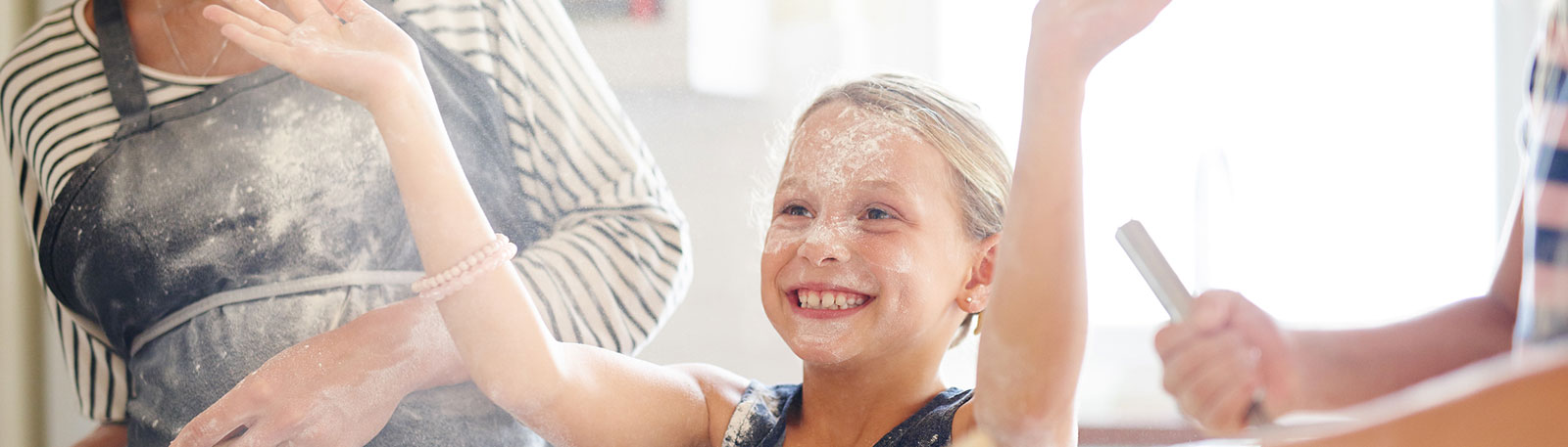 Young child and parents baking