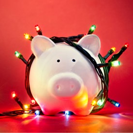 piggy bank wrapped in Christmas lights