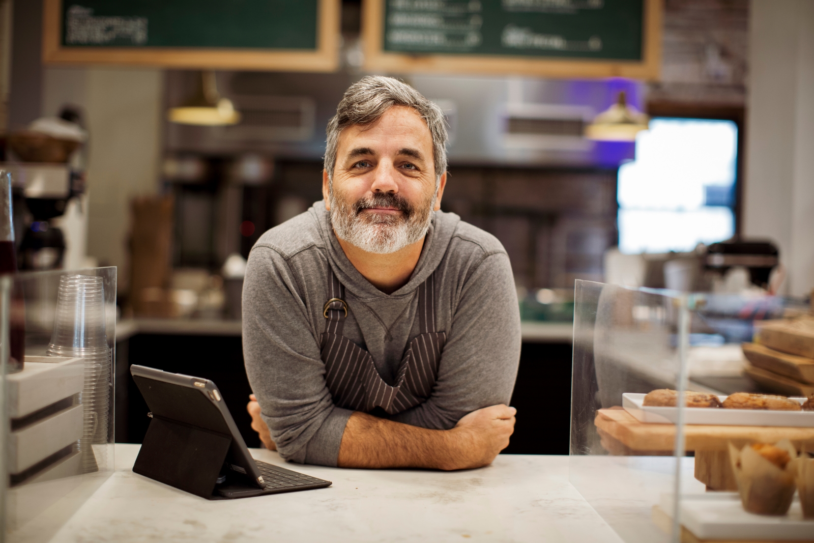 Man leaning on a counter top