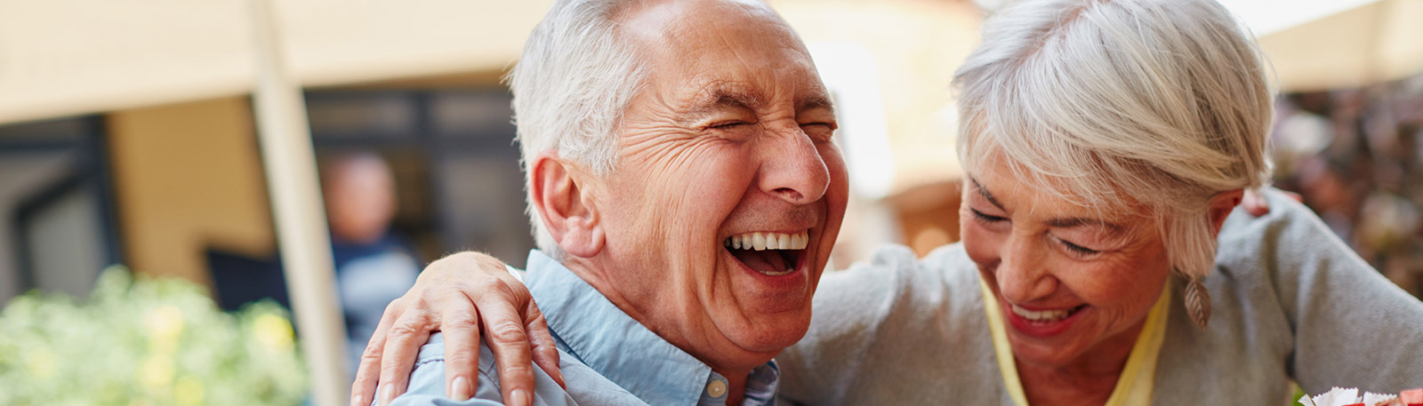 Mature couple laughing outdoors